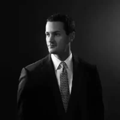 Andrew J Karian